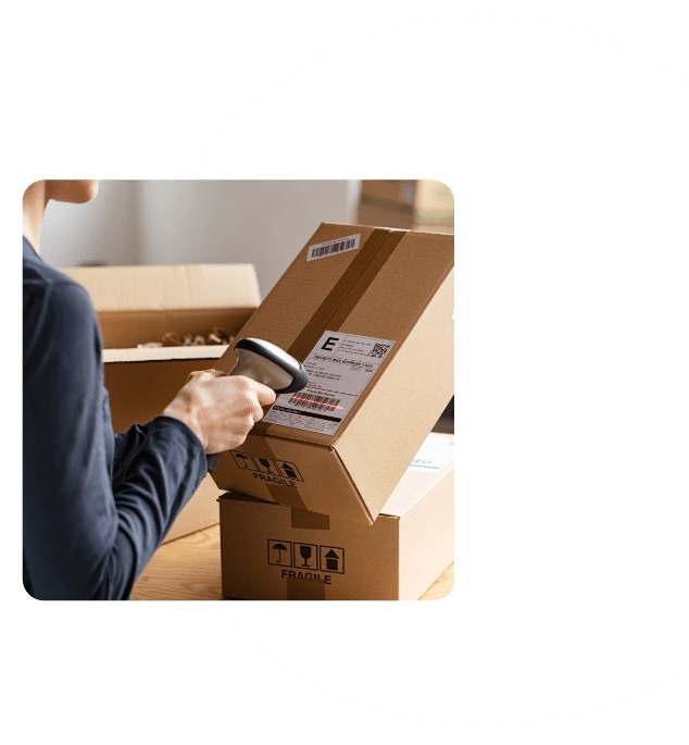 Reverse Logistics Manager Scans Barcode on Package