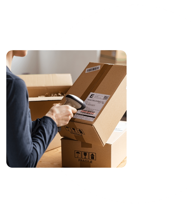 Reverse Logistics Manager Scans Barcode on Package