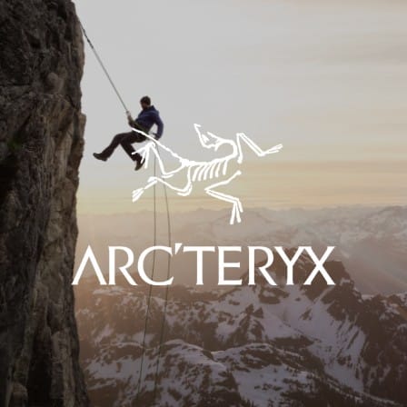 Arc'teryx logo with a man repelling down the side of a mountain.