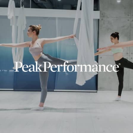Dancers practicing with Peak Performance logo