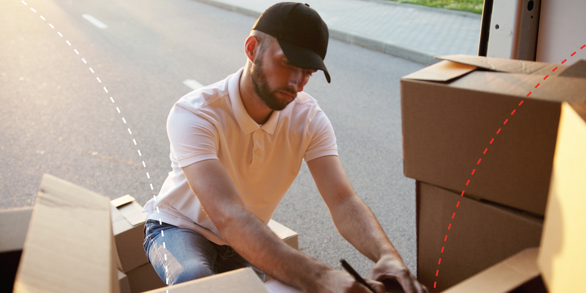 image of man with boxes in the back of truck