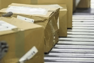 Returned boxes on a conveyor belt