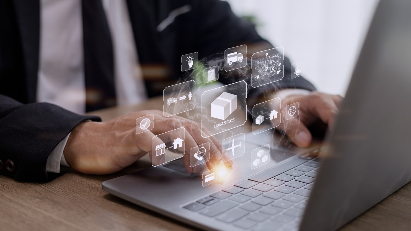 Man in Suit Uses Computer to Configure Reverse Logistics Process