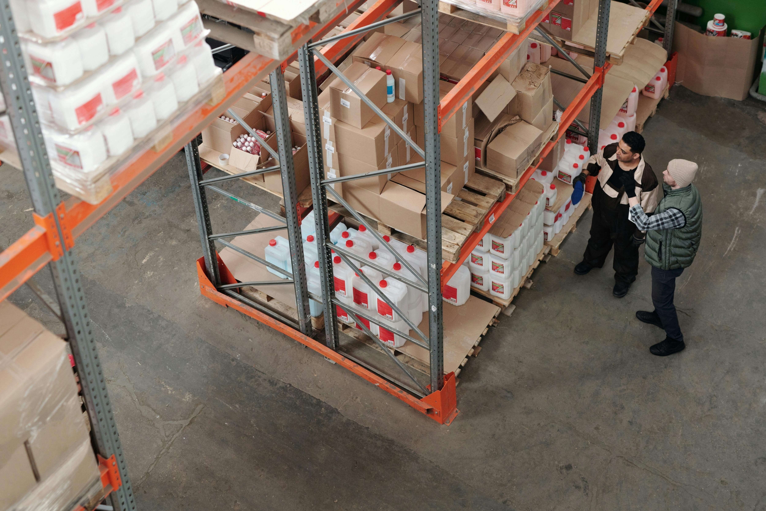 A warehouse team inspects products in a warehouse after they pass through customers.