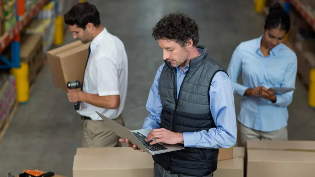 Warehouse team checking returned stock against inventory records