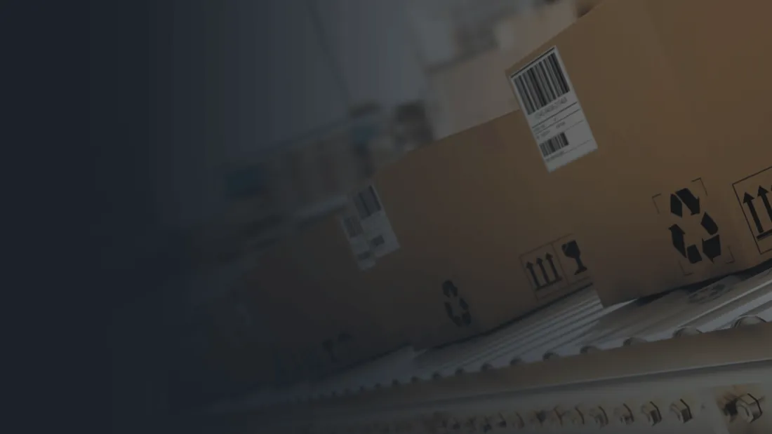 Returned cartons moving along a conveyor into a receiving line