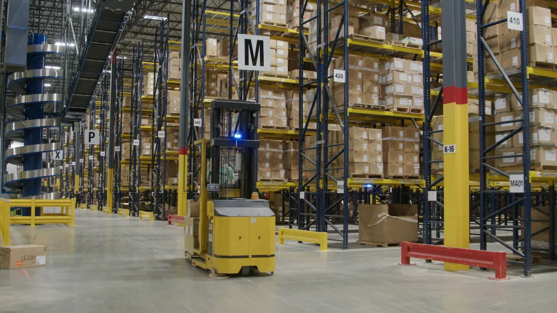 Warehouse racking stocked with inventory and returns ahead of resale