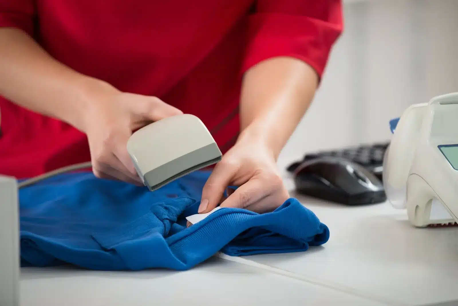 Returned apparel being inspected and graded at a receiving bench