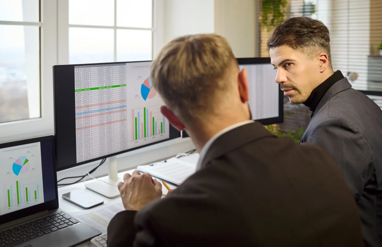 Analyst comparing a late spreadsheet report with a live returns view showing reasons by SKU