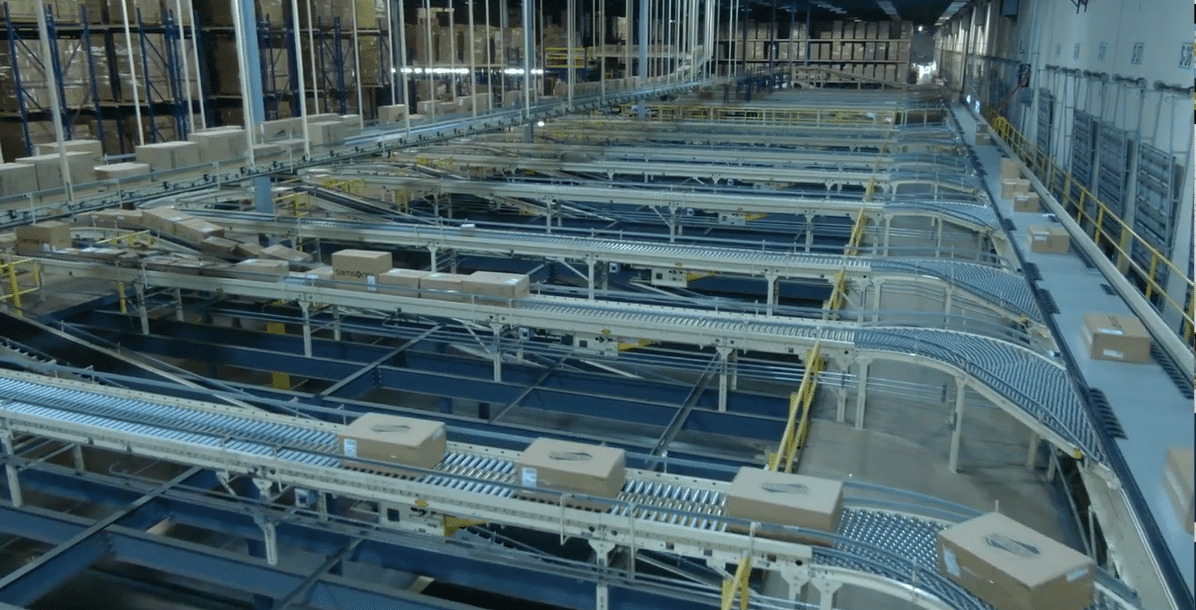 Warehouse Inventory and Packages Move Across Conveyor Belts